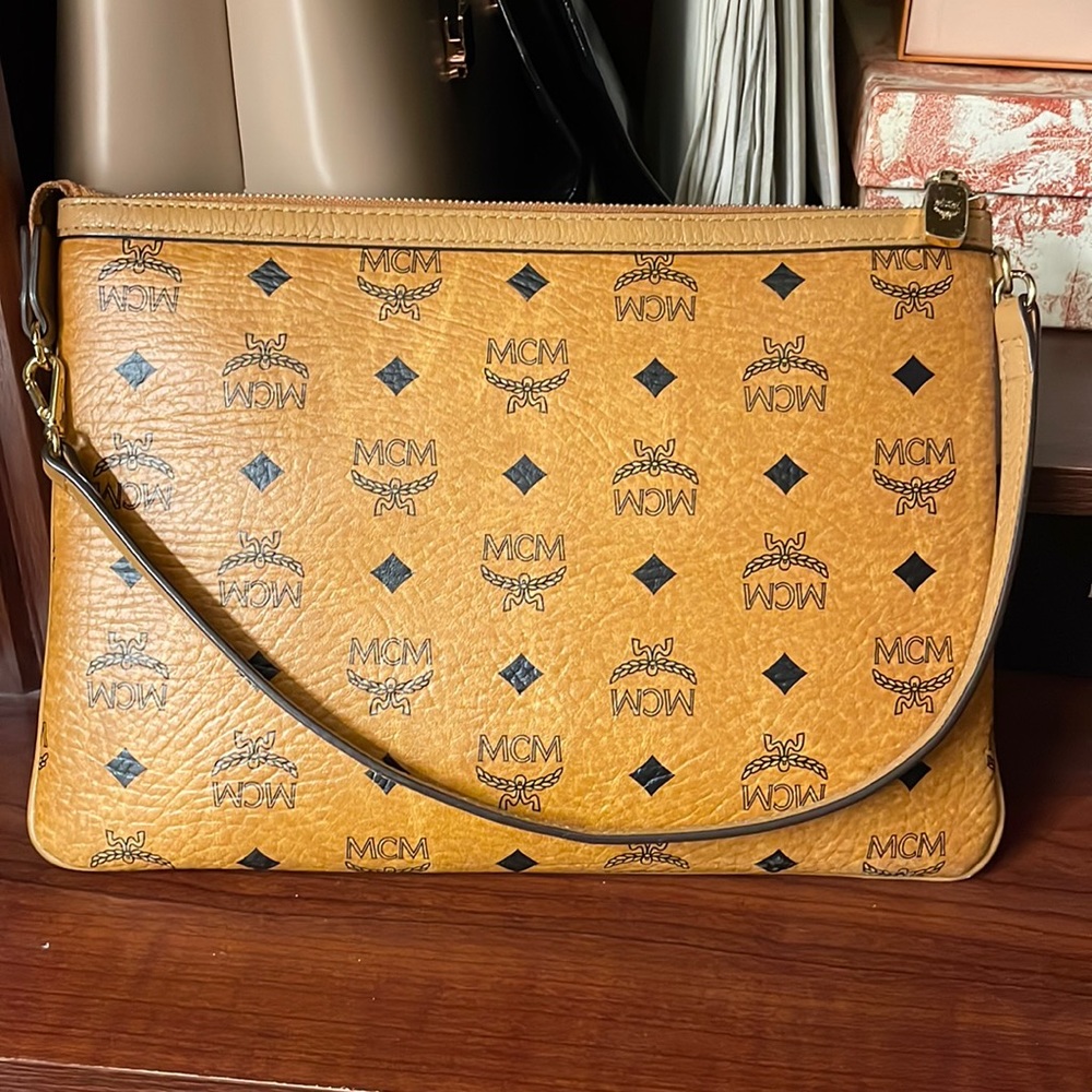 Adorable leather shoulder bag that can with a large mcm tote bag